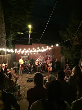 The River Arkansas performs at a backyard party from Strings & Wood.
