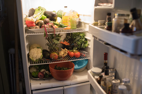 Living a vegan lifestyle, their fridge is filled with fruits and vegetables.